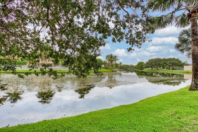 a view of a lake with a yard
