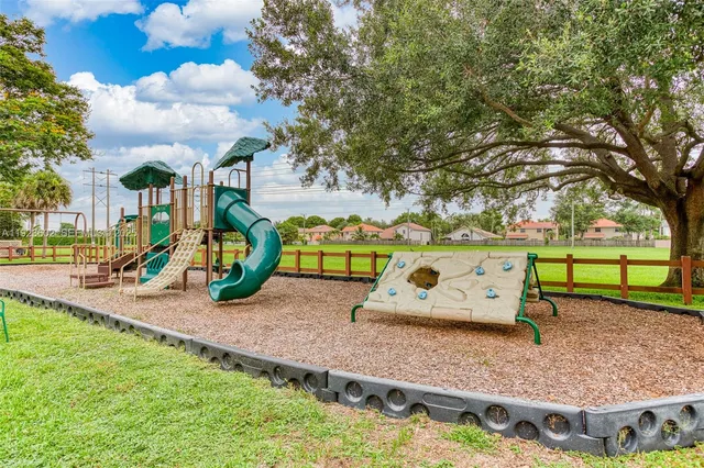 a view of a park with large trees