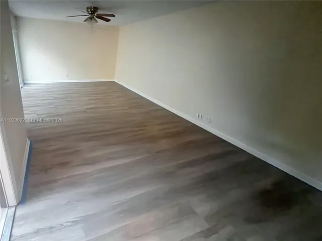 a view of a big room with wooden floor