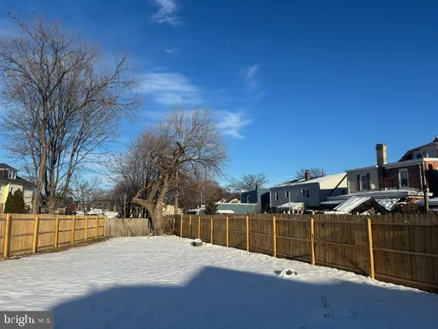 a street view with wooden fence