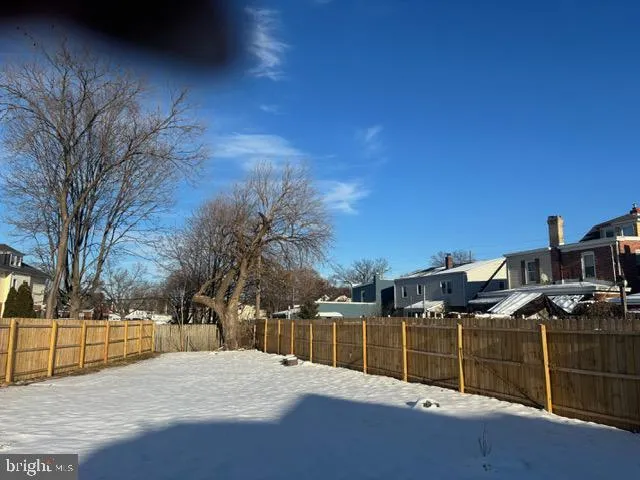 a view of swimming pool with a yard