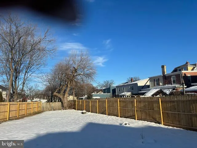 a view of swimming pool with a yard