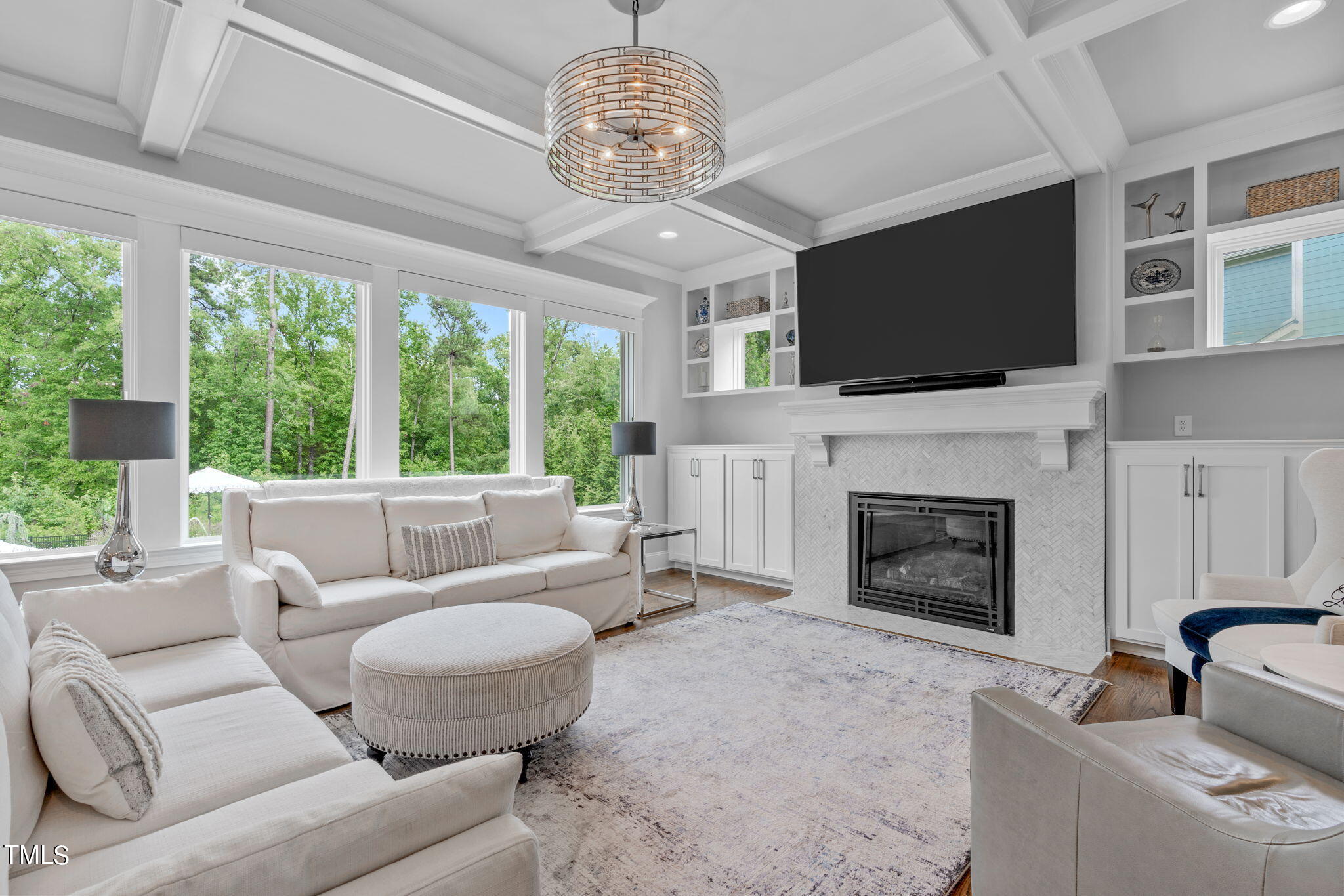 3130 Mantle Ridge Drive Apex, NC 27502 - Photo 12 of 81 a living room with furniture a fireplace and a flat screen tv