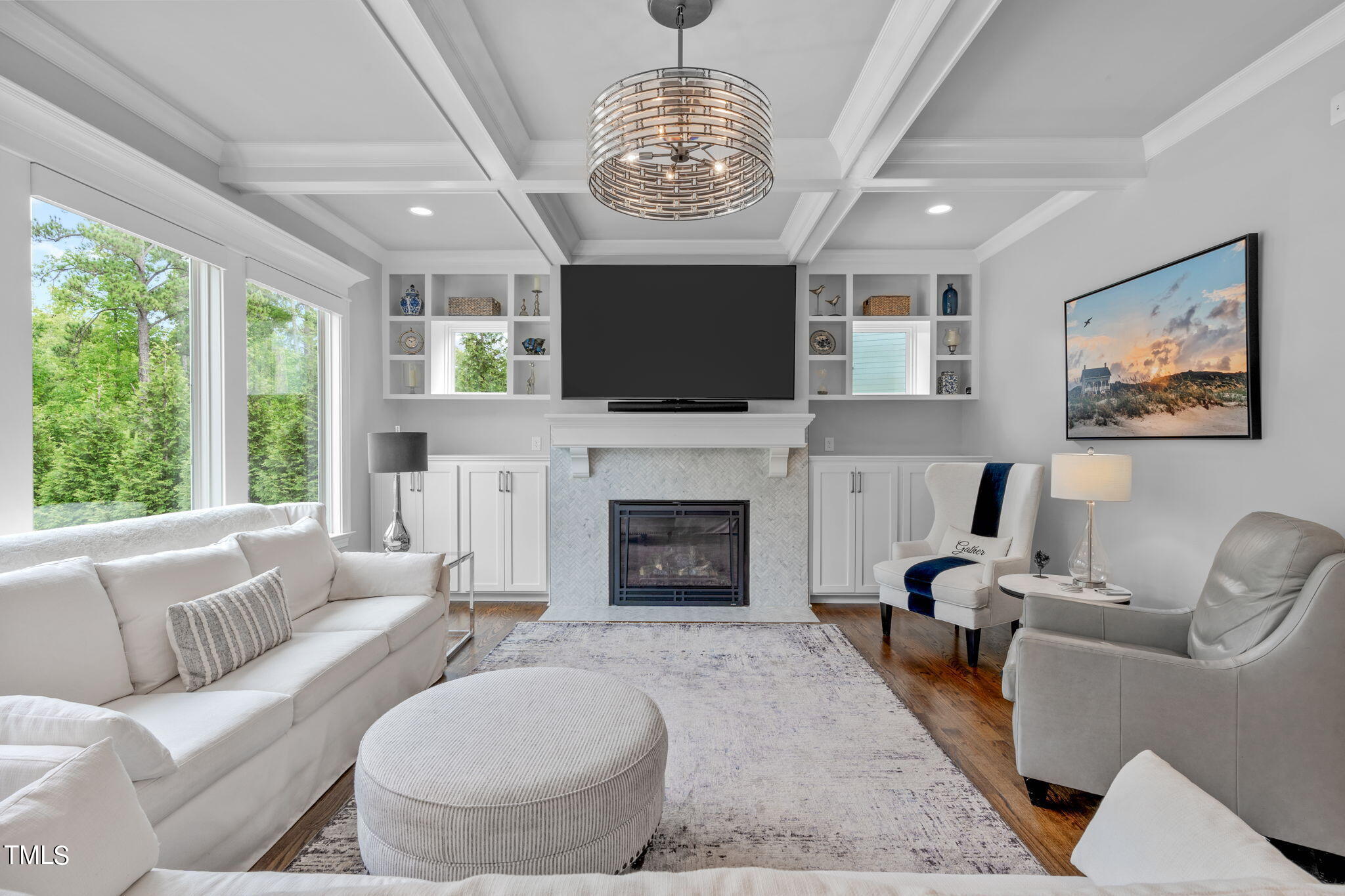 3130 Mantle Ridge Drive Apex, NC 27502 - Photo 16 of 81 a living room with furniture a fireplace and a flat screen tv
