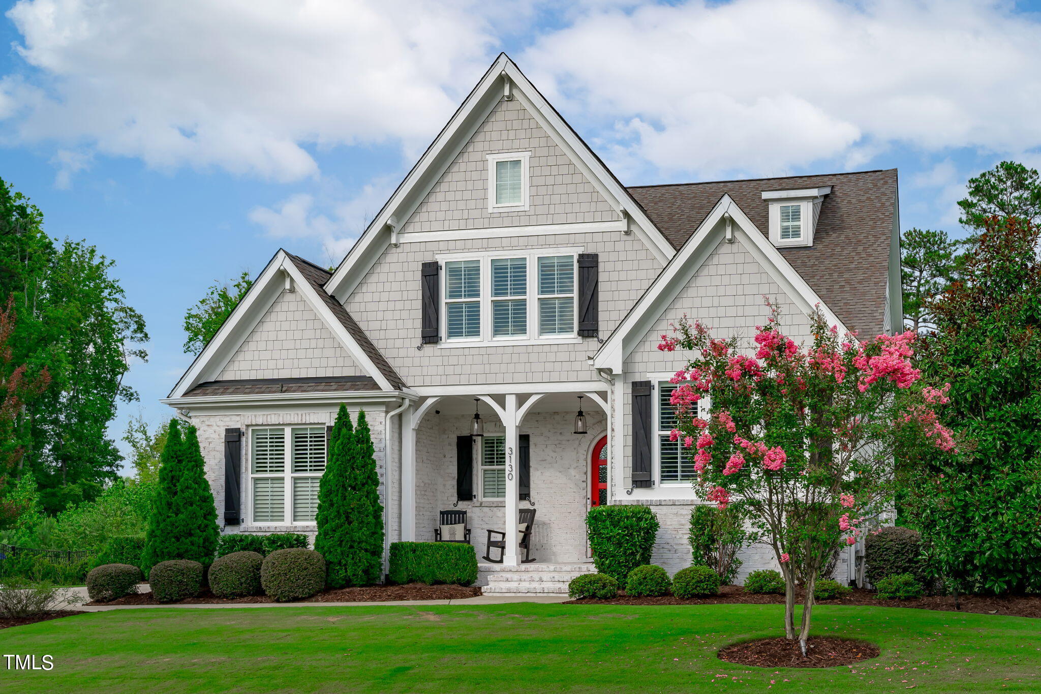 3130 Mantle Ridge Drive Apex, NC 27502 - Photo 2 of 81 a front view of a house with a yard and trees
