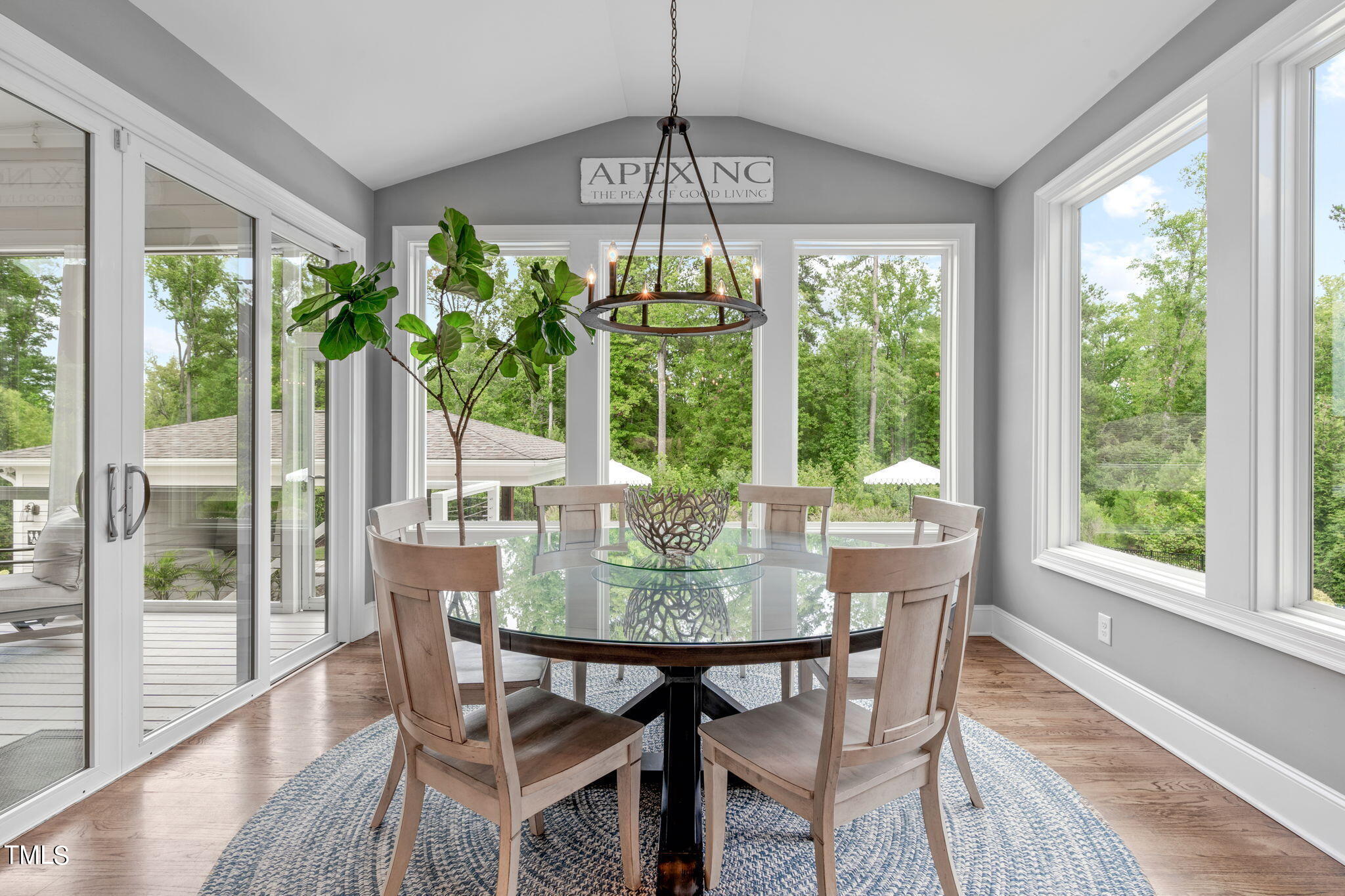 3130 Mantle Ridge Drive Apex, NC 27502 - Photo 23 of 81 a view of a dining room with furniture window and outside view