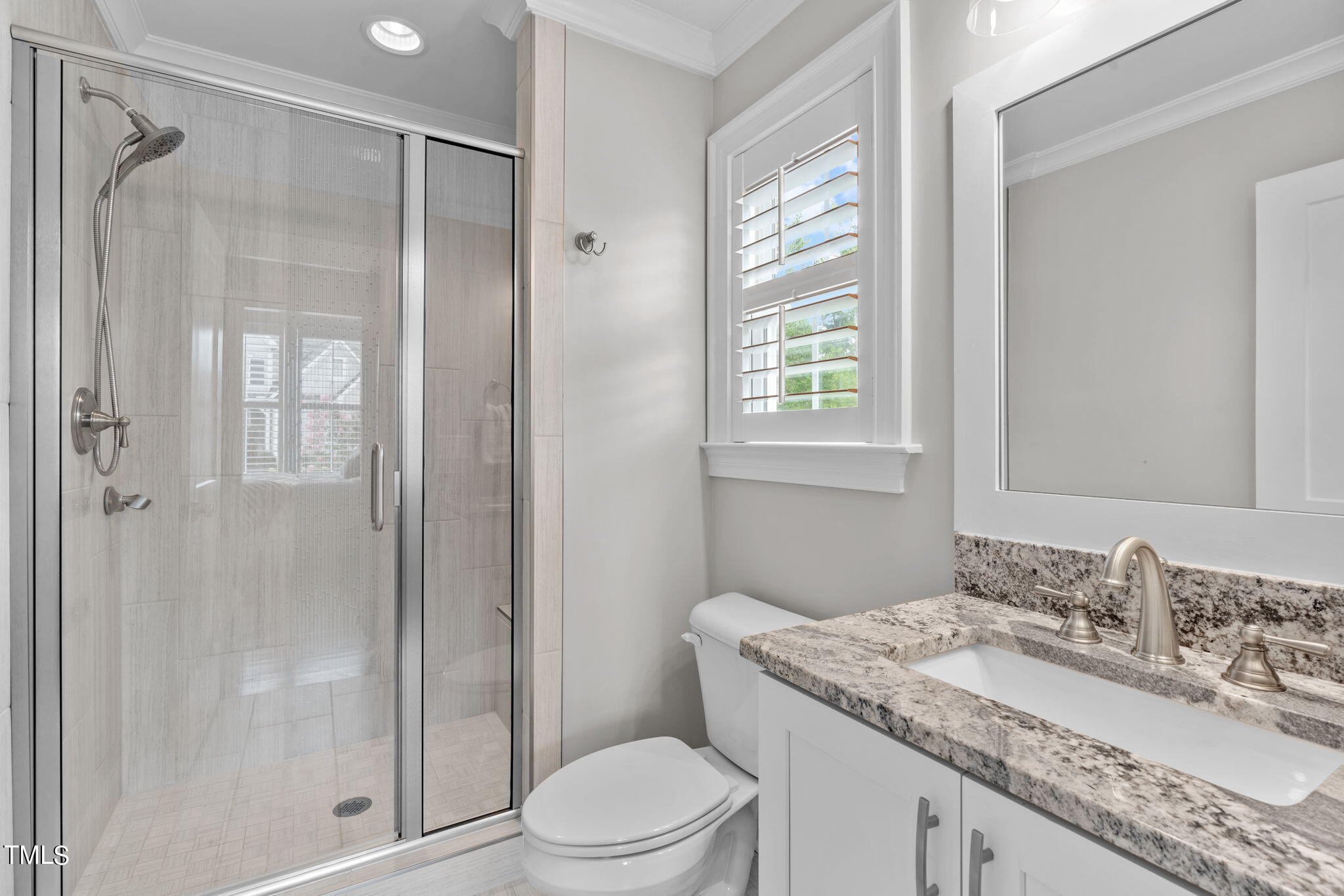 3130 Mantle Ridge Drive Apex, NC 27502 - Photo 29 of 81 a bathroom with a granite countertop sink toilet and shower