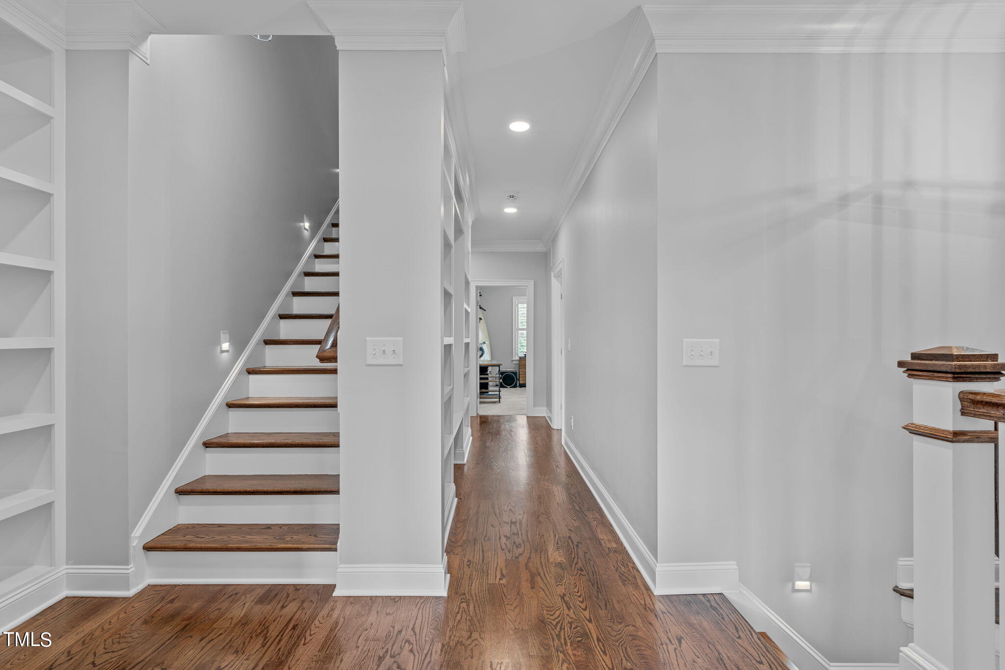 3130 Mantle Ridge Drive Apex, NC 27502 - Photo 30 of 81 a view of a hallway with wooden floor and entryway