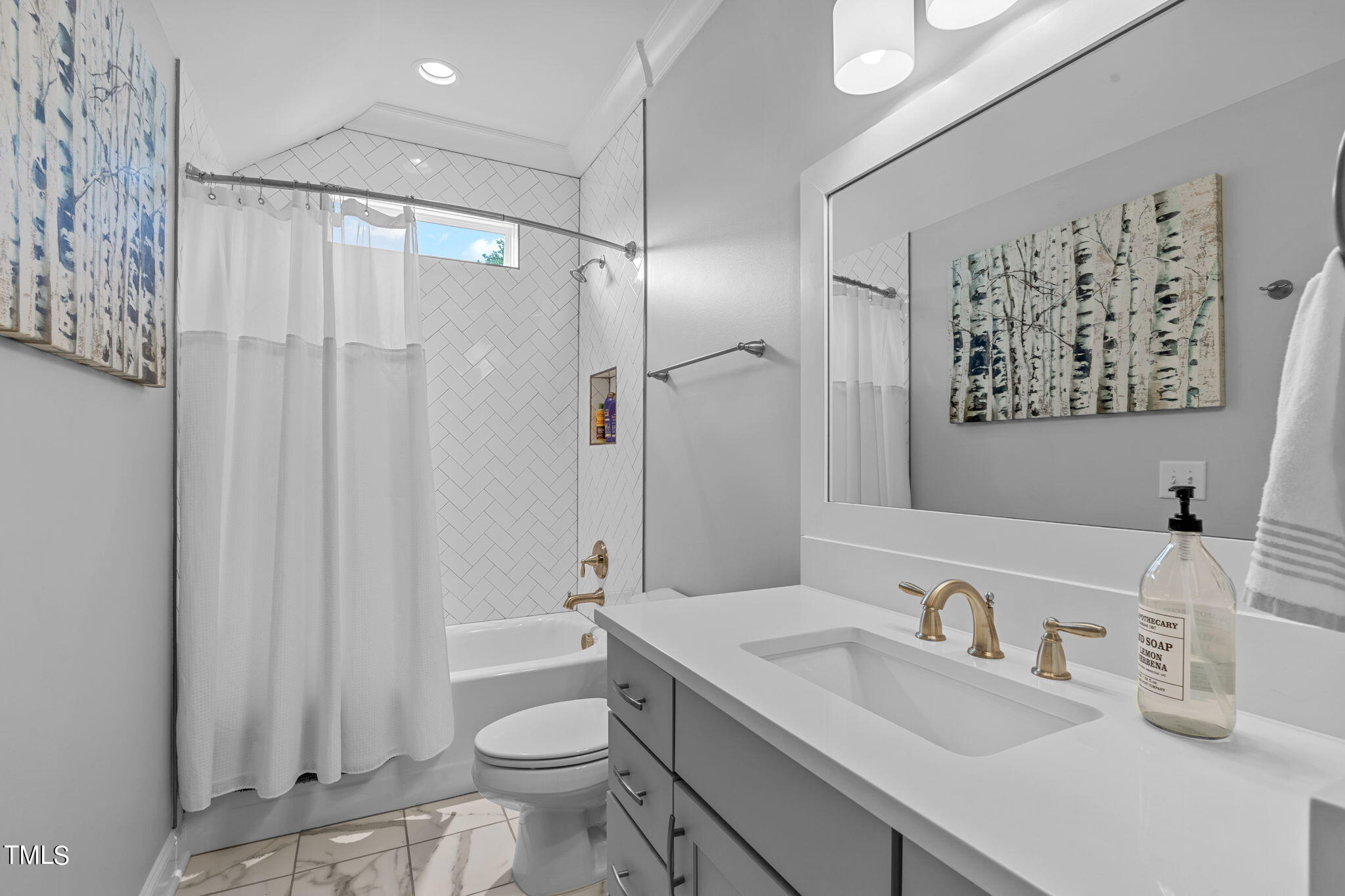 3130 Mantle Ridge Drive Apex, NC 27502 - Photo 35 of 81 a bathroom with a sink toilet vanity and shower