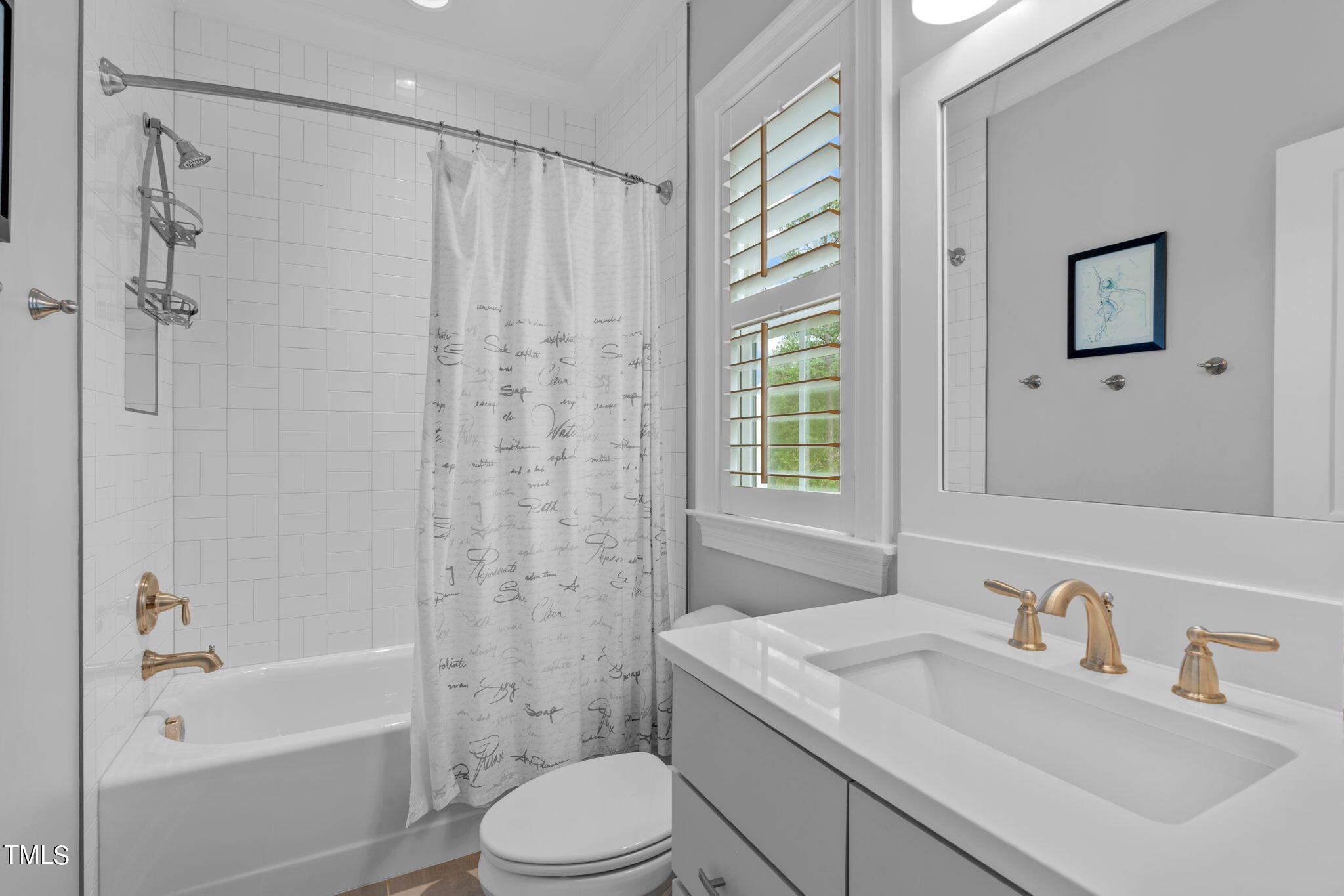 3130 Mantle Ridge Drive Apex, NC 27502 - Photo 37 of 81 a bathroom with a granite countertop sink a toilet and shower