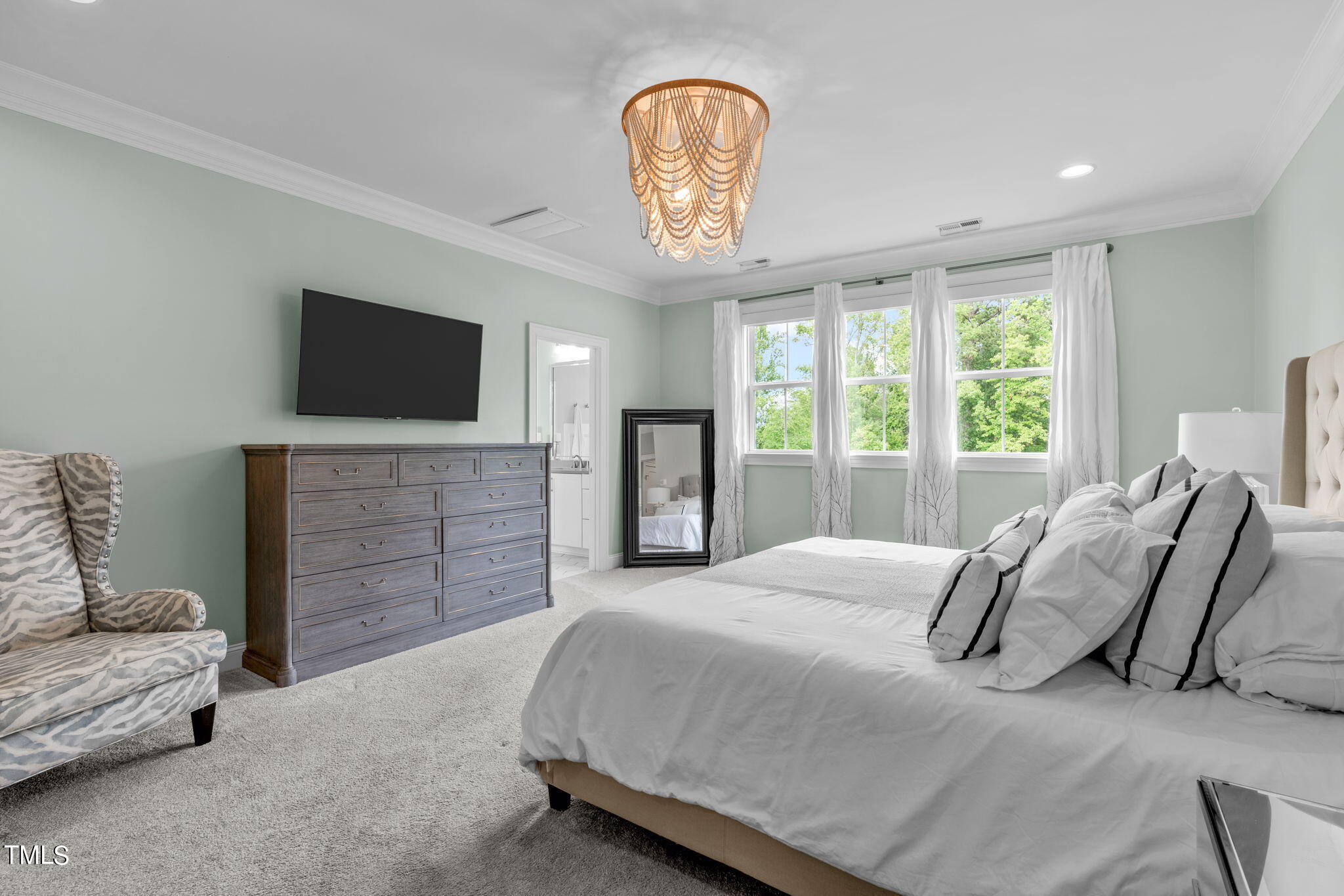 3130 Mantle Ridge Drive Apex, NC 27502 - Photo 41 of 81 a spacious bedroom with a bed and a television