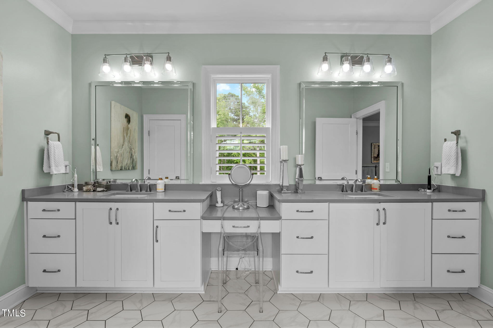 3130 Mantle Ridge Drive Apex, NC 27502 - Photo 47 of 81 a bathroom with a granite countertop sink two large mirror and cabinets