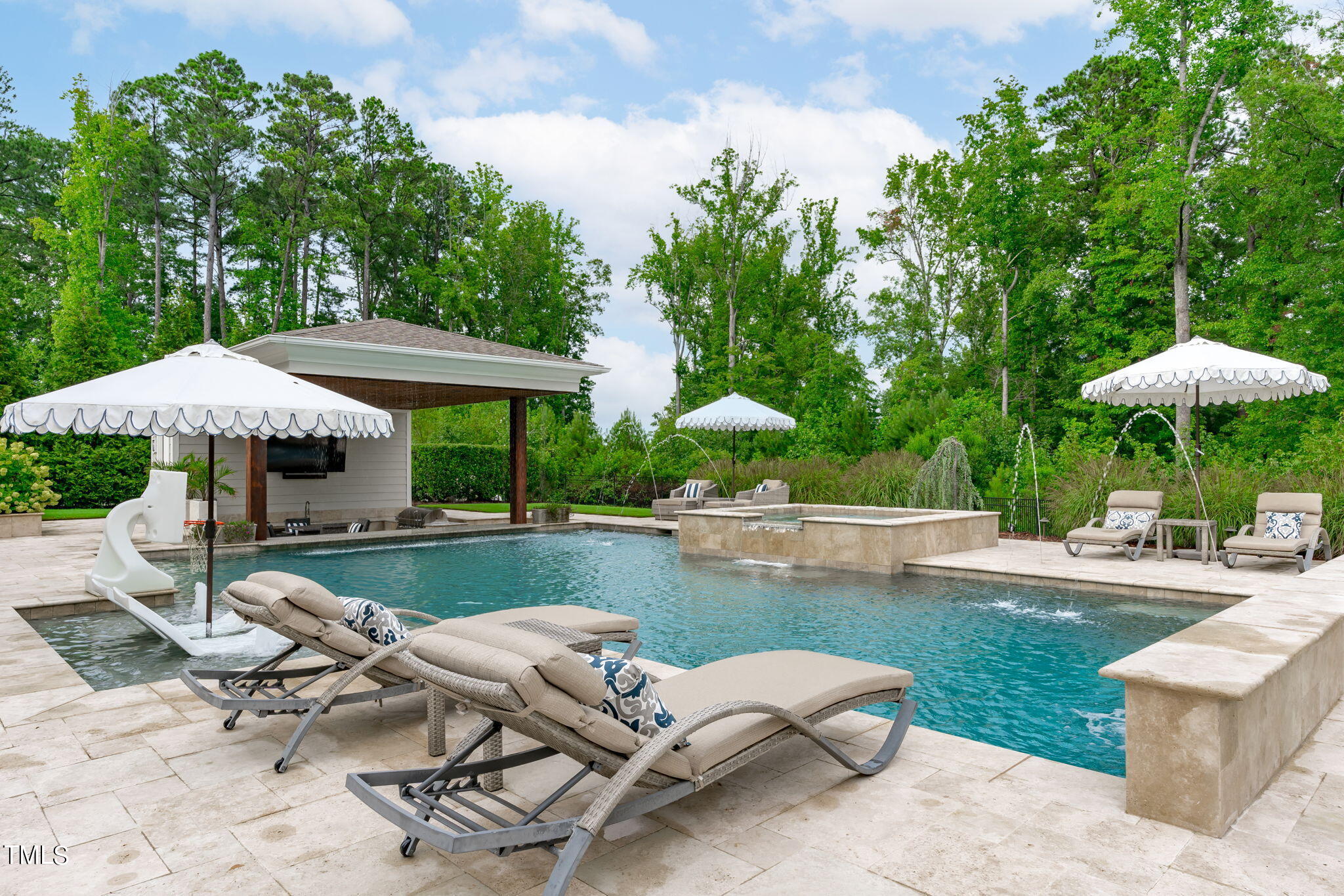 3130 Mantle Ridge Drive Apex, NC 27502 - Photo 68 of 81 a view of a swimming pool with lounge chairs in the patio