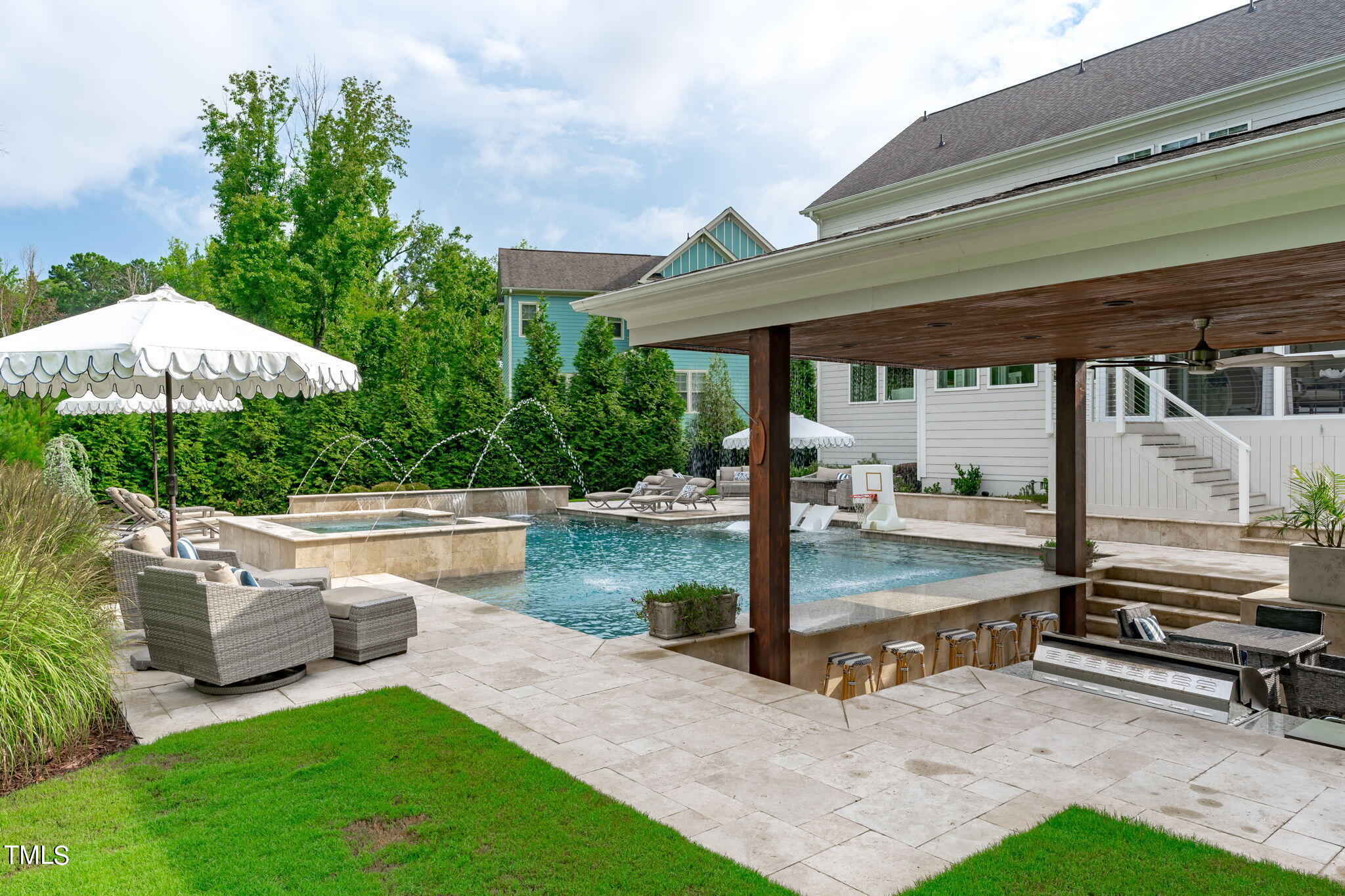 3130 Mantle Ridge Drive Apex, NC 27502 - Photo 74 of 81 a view of a patio with a table chairs and a swimming pool
