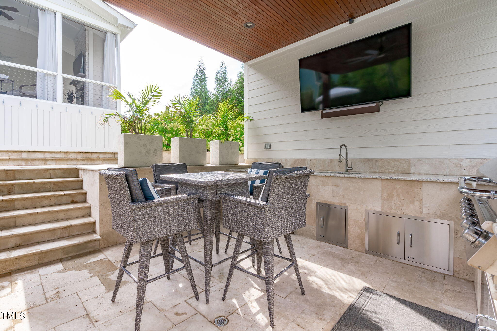 3130 Mantle Ridge Drive Apex, NC 27502 - Photo 75 of 81 a view of a dining room with furniture and a flat screen tv