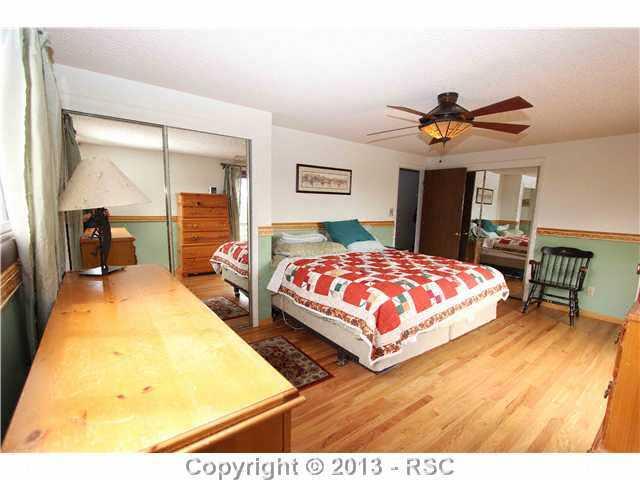 2720 Rigel Drive Colorado Springs, CO 80906 - Photo 6 of 19 Master Bedroom with Walkout Deck