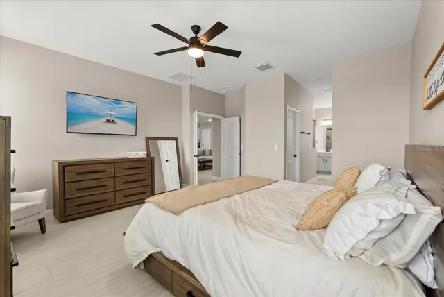 a bedroom with a bed and a tv