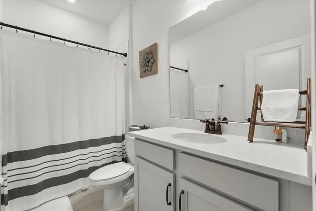 a bed room with furniture and a window