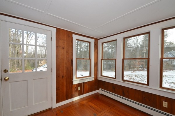 537 Fitchburg State Road Ashby, MA 01431 - Photo 14 of 17 a view of an empty room with a window and wooden floor