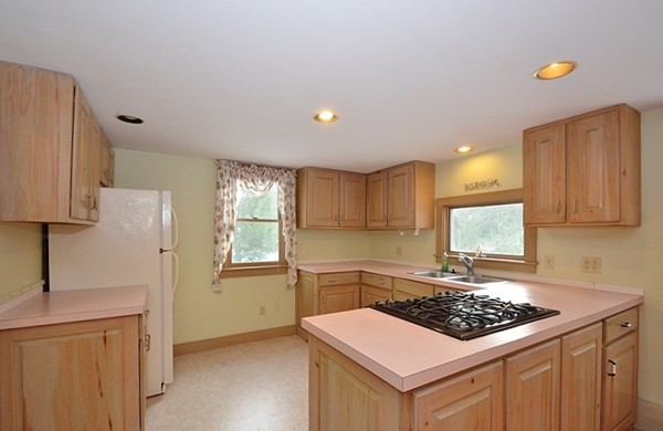 537 Fitchburg State Road Ashby, MA 01431 - Photo 5 of 17 a kitchen with a stove a sink and a refrigerator