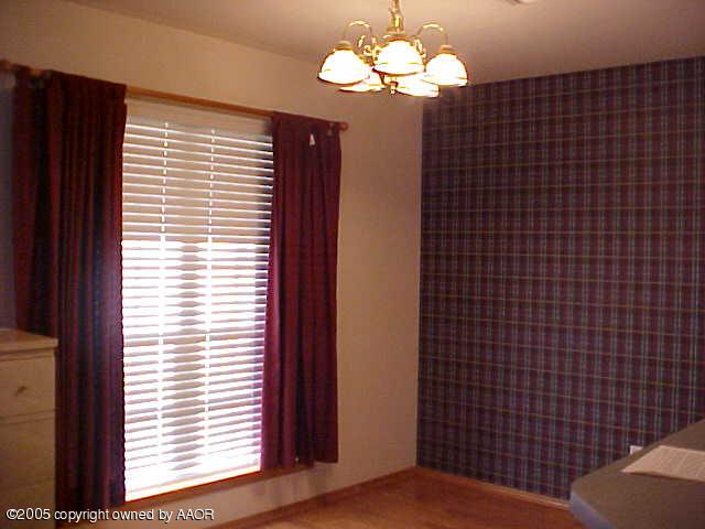 5204 Capulin Lane Amarillo, TX 79110 - Photo 5 of 10 a view of a livingroom with a window