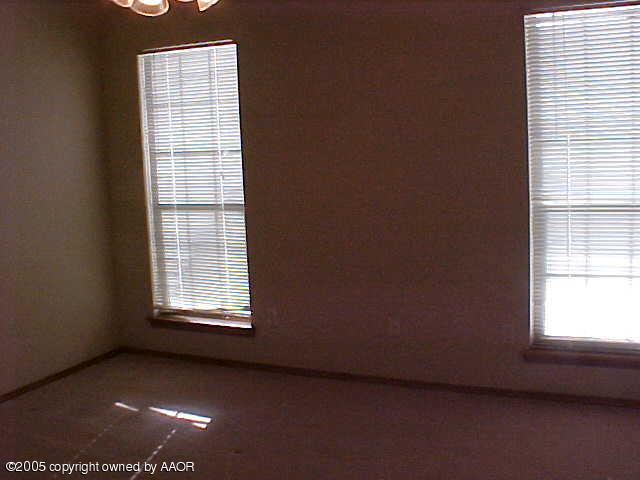 5204 Capulin Lane Amarillo, TX 79110 - Photo 6 of 10 an empty room with a window