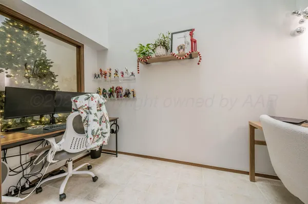 a workspace with furniture and window