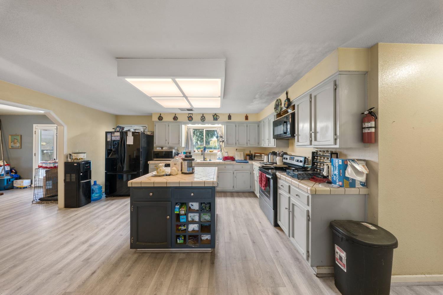 2779 Story Avenue Merced, CA 95340 - Photo 7 of 27 a living room with stainless steel appliances furniture a kitchen view and a kitchen view