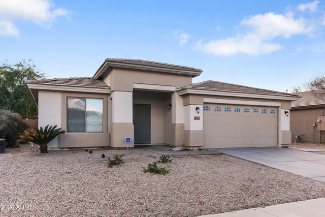 a front view of house with a garden