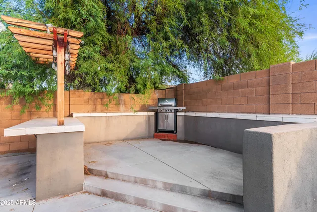 a view of a backyard with sitting area