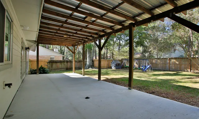 a view of a room with wooden roof and windows