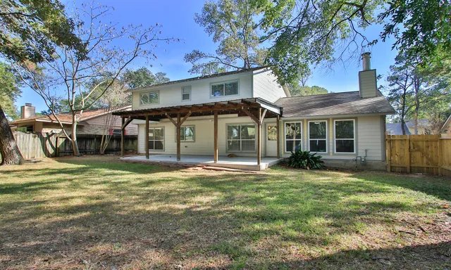 a view of a house with basketball court