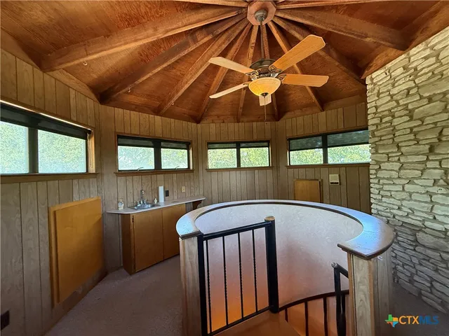 a bedroom with a bed and a mirror