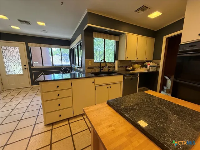 a bedroom with furniture and a chandelier