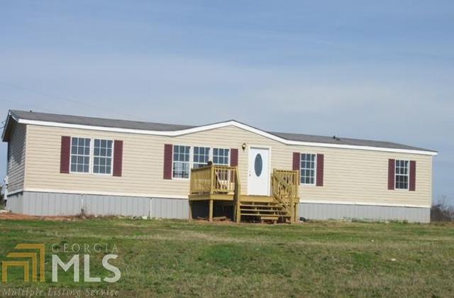 100 Jackson Bridge Road Canon, GA 30520 - Photo 1 of 1 a view of a house with a backyard