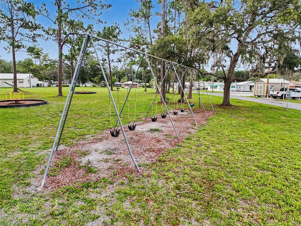 2092 Culbreath Road, Unit A42 Brooksville, FL 34602 - Photo 27 of 70 a view of a park with swings