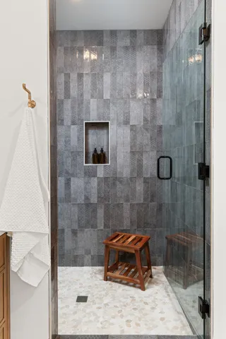a bathroom with a shower and a sink