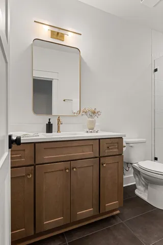 a bathroom with a double vanity sink and a mirror