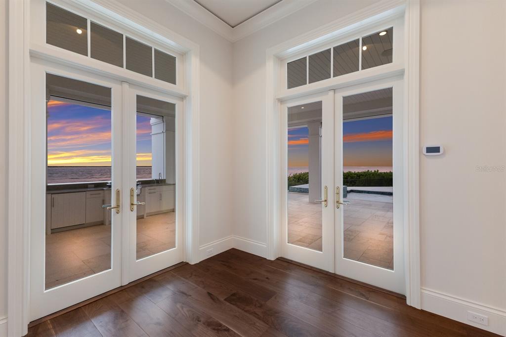 894 Hill Tide Lane Boca Grande, FL 33921 - Photo 19 of 100 a view of an entryway with wooden floor and door