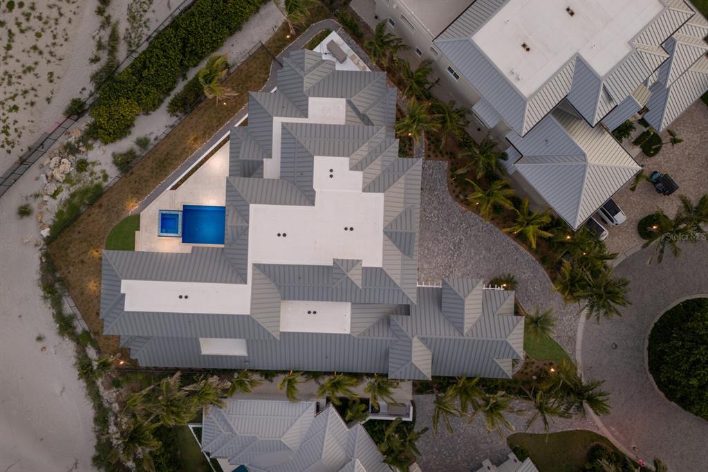 894 Hill Tide Lane Boca Grande, FL 33921 - Photo 99 of 100 an aerial view of a house with a yard