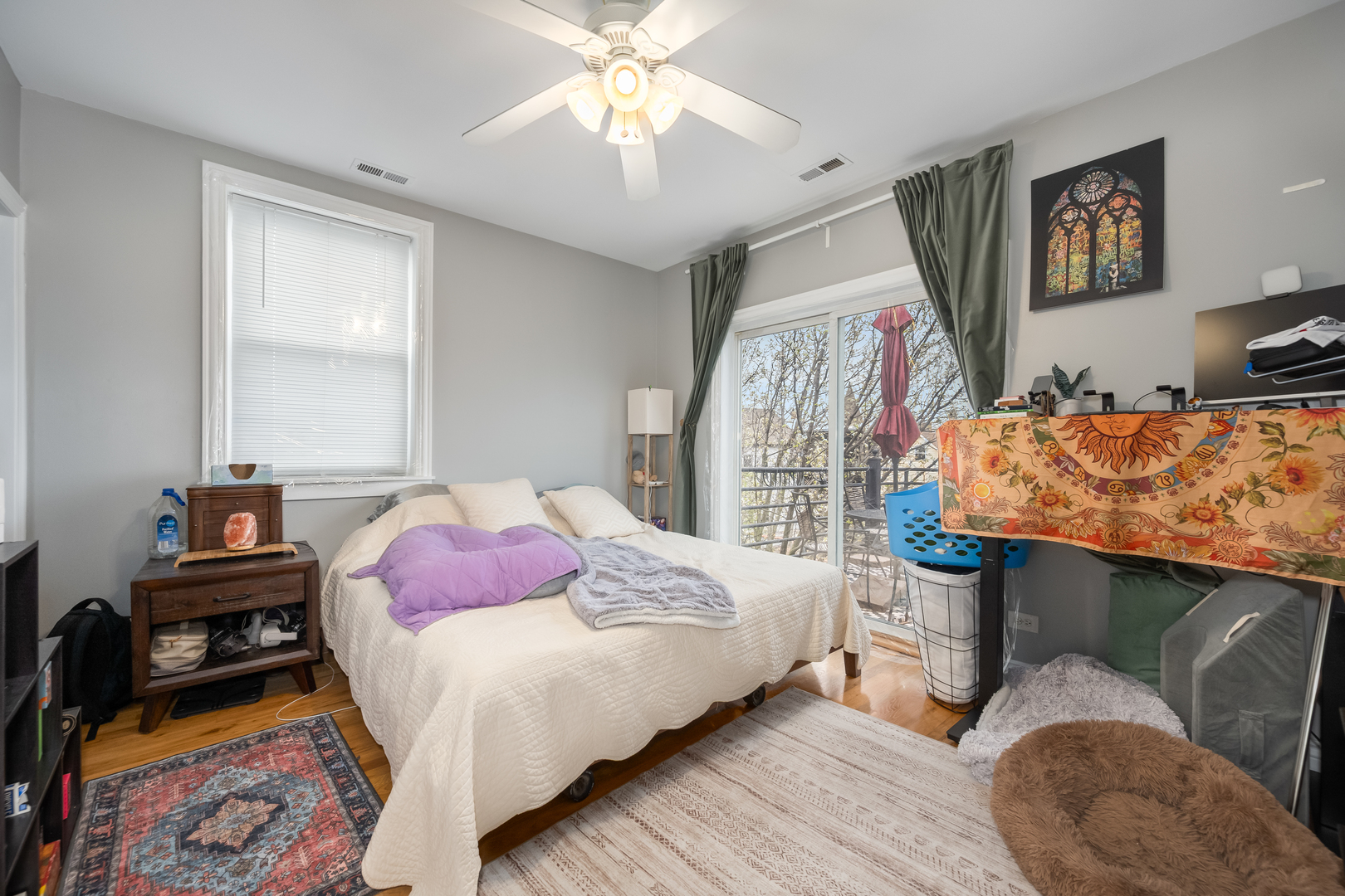 1710 North Whipple Street, Unit 3 Chicago, IL 60647 - Photo 10 of 17 a bedroom with a bed and a chandelier