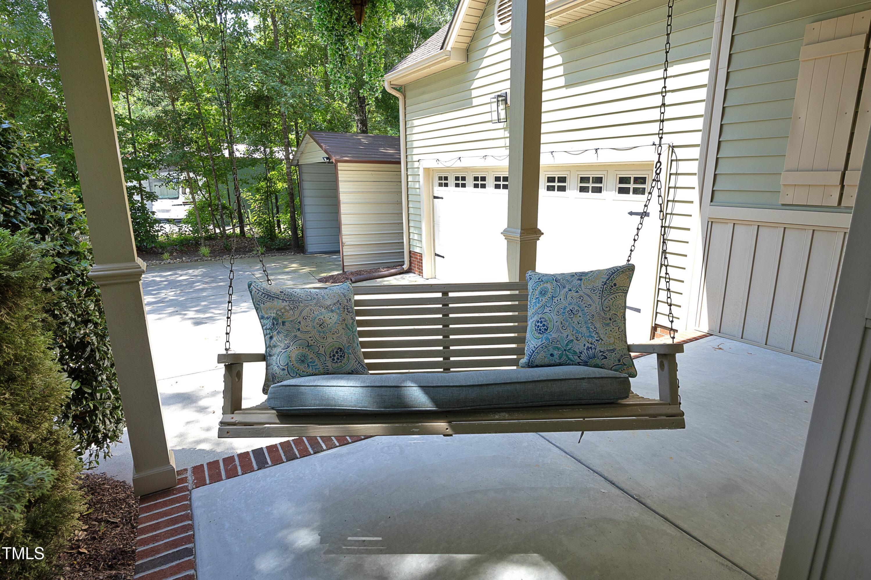 150 Churchill Road Louisburg, NC 27549 - Photo 7 of 50 07PorchSwing