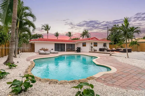 a view of a swimming pool with a lounge chairs