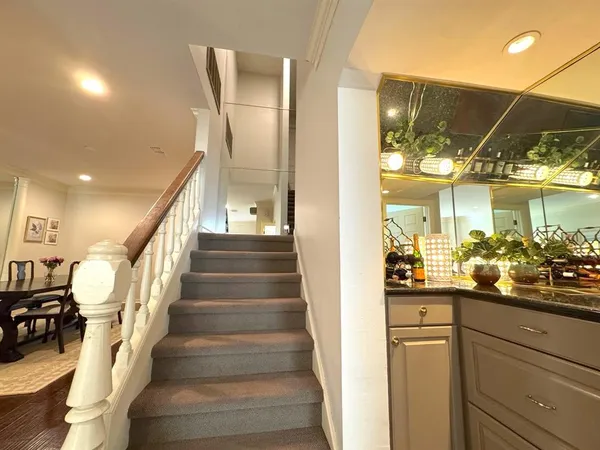 a bedroom with a large bed and a couch