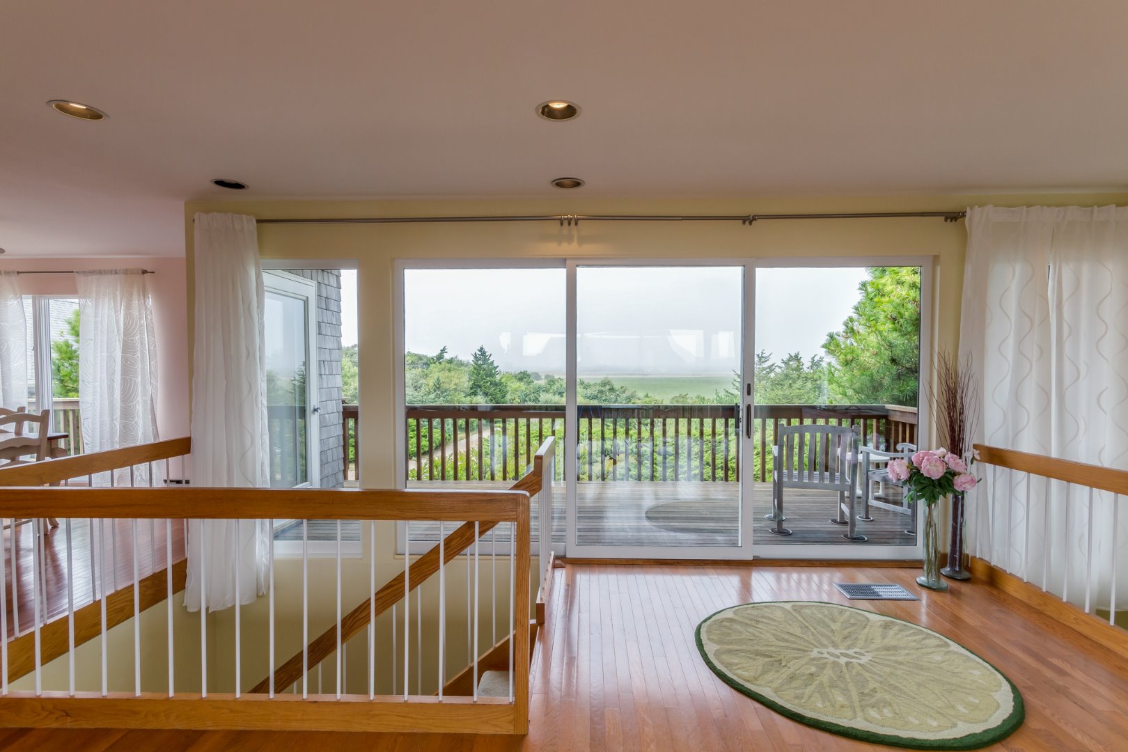 4 Katama Farm Road Edgartown, MA 02539 - Photo 20 of 40 Sliders to the deck overlooking the Katama Farm.