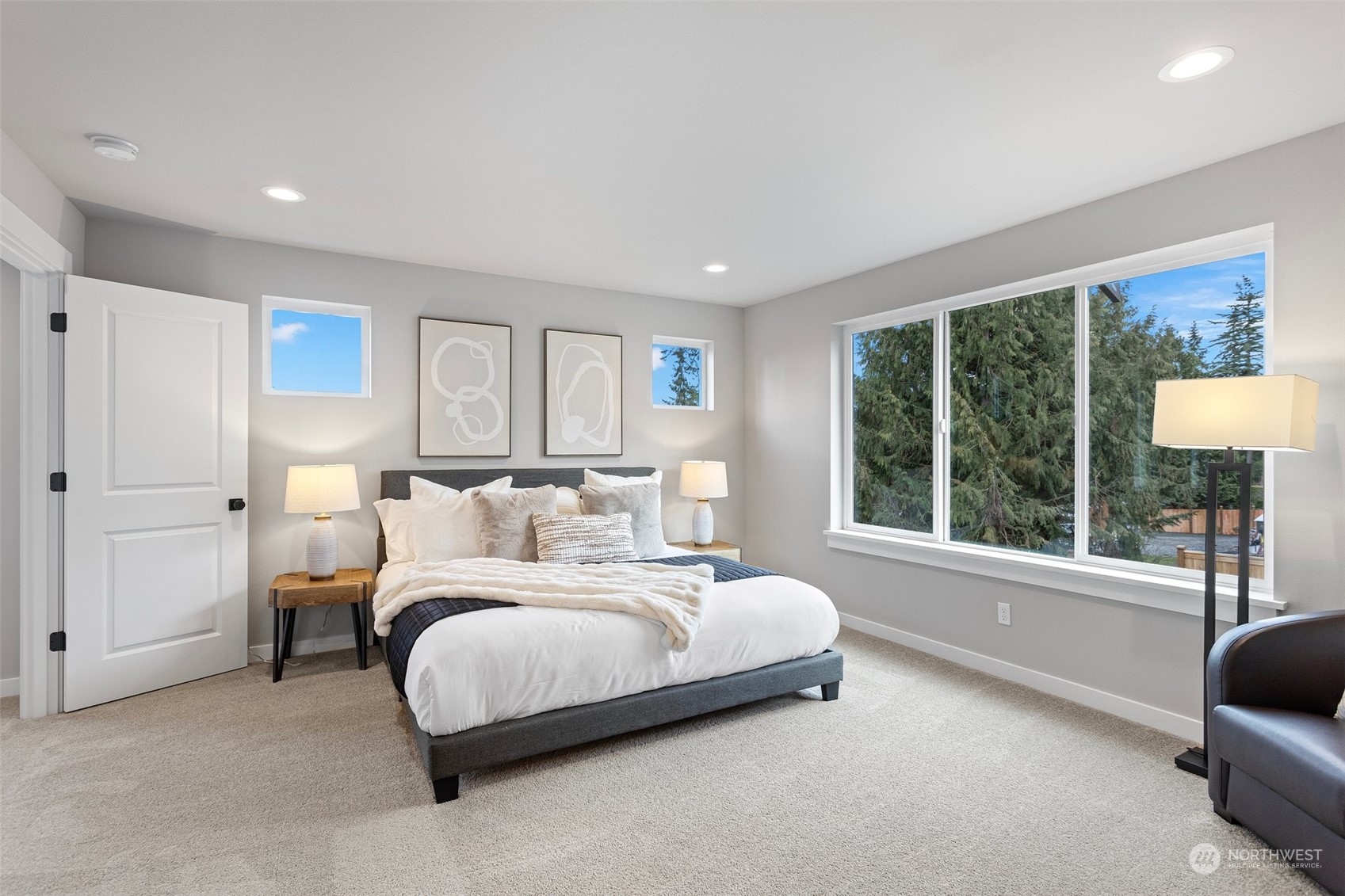 116 161st Street Southeast, Unit 1 Bothell, WA 98012 - Photo 19 of 37 a bedroom with a bed and a large window