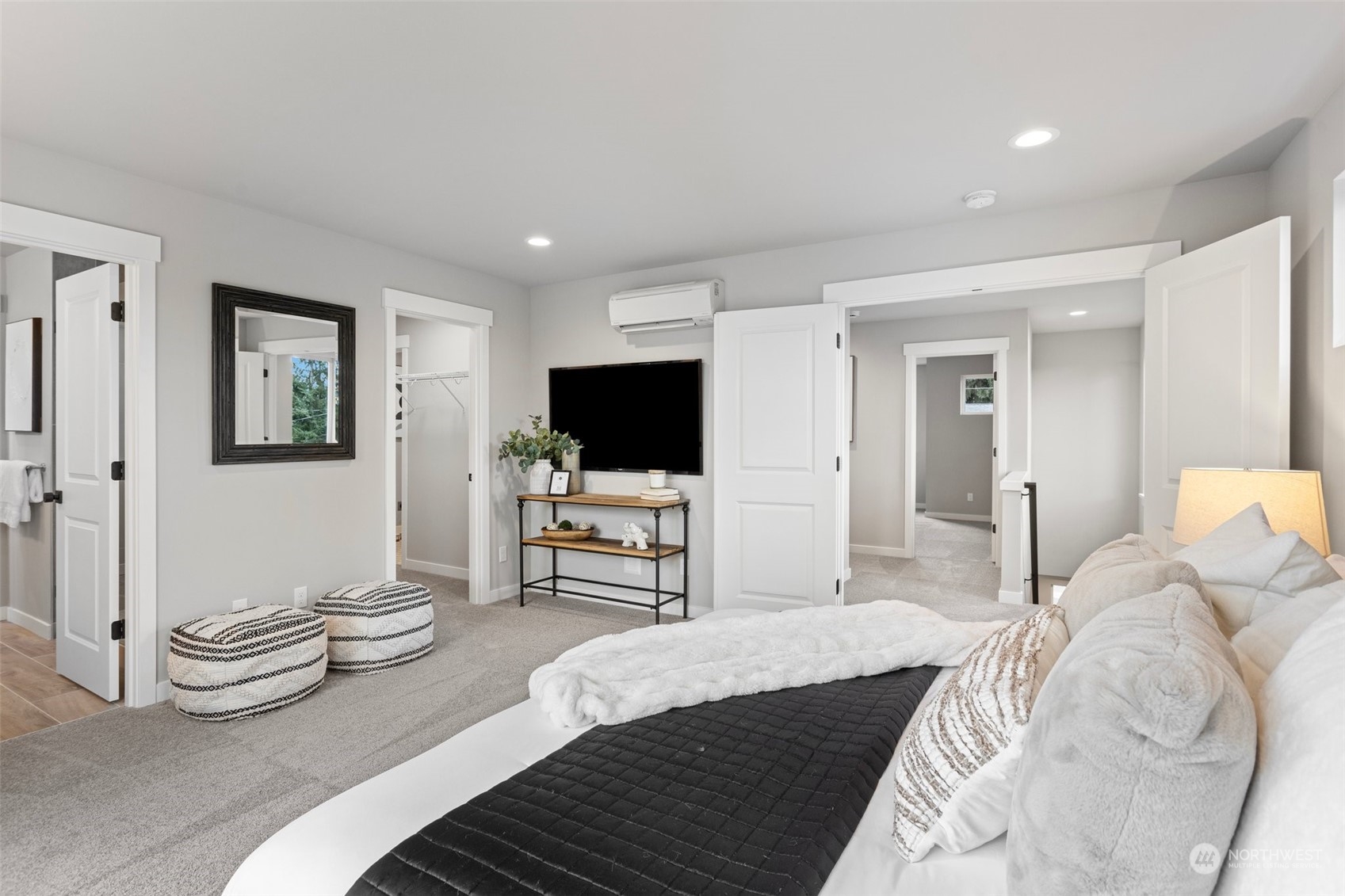 116 161st Street Southeast, Unit 1 Bothell, WA 98012 - Photo 21 of 37 a bedroom with furniture and a flat screen tv