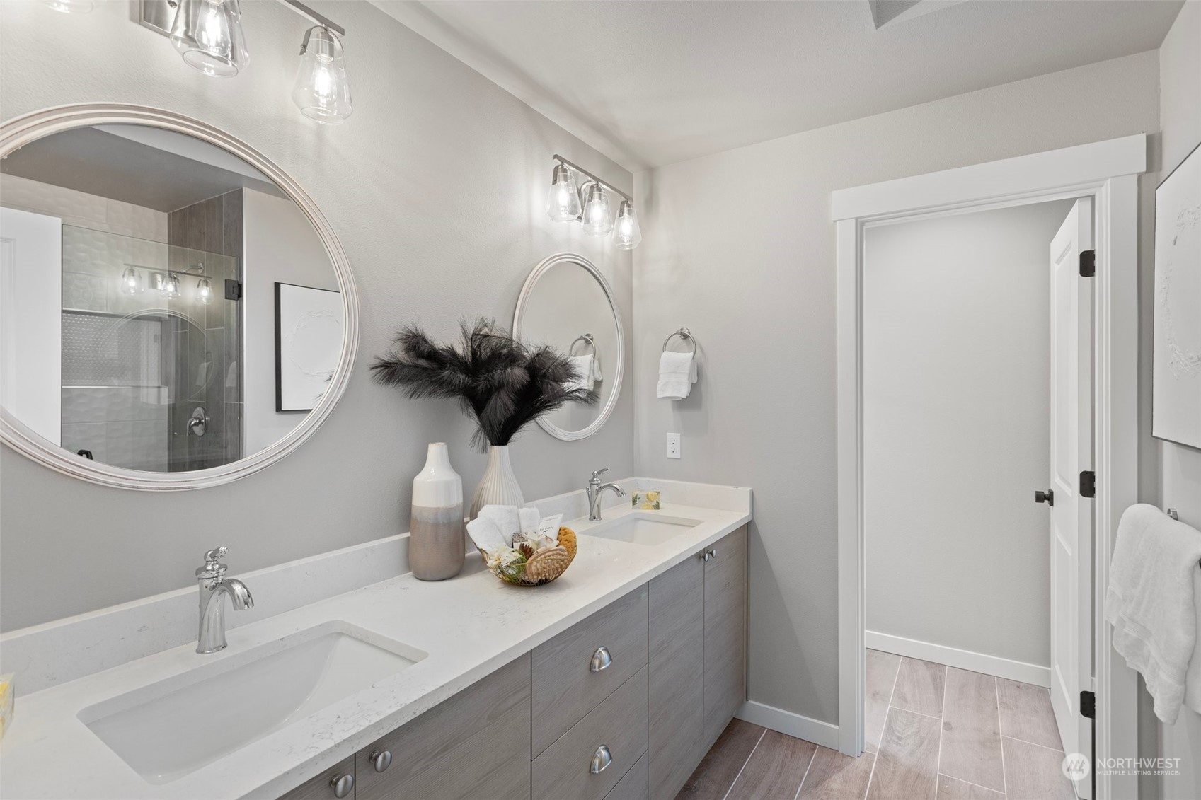116 161st Street Southeast, Unit 1 Bothell, WA 98012 - Photo 22 of 37 a bathroom with a double vanity sink and a mirror