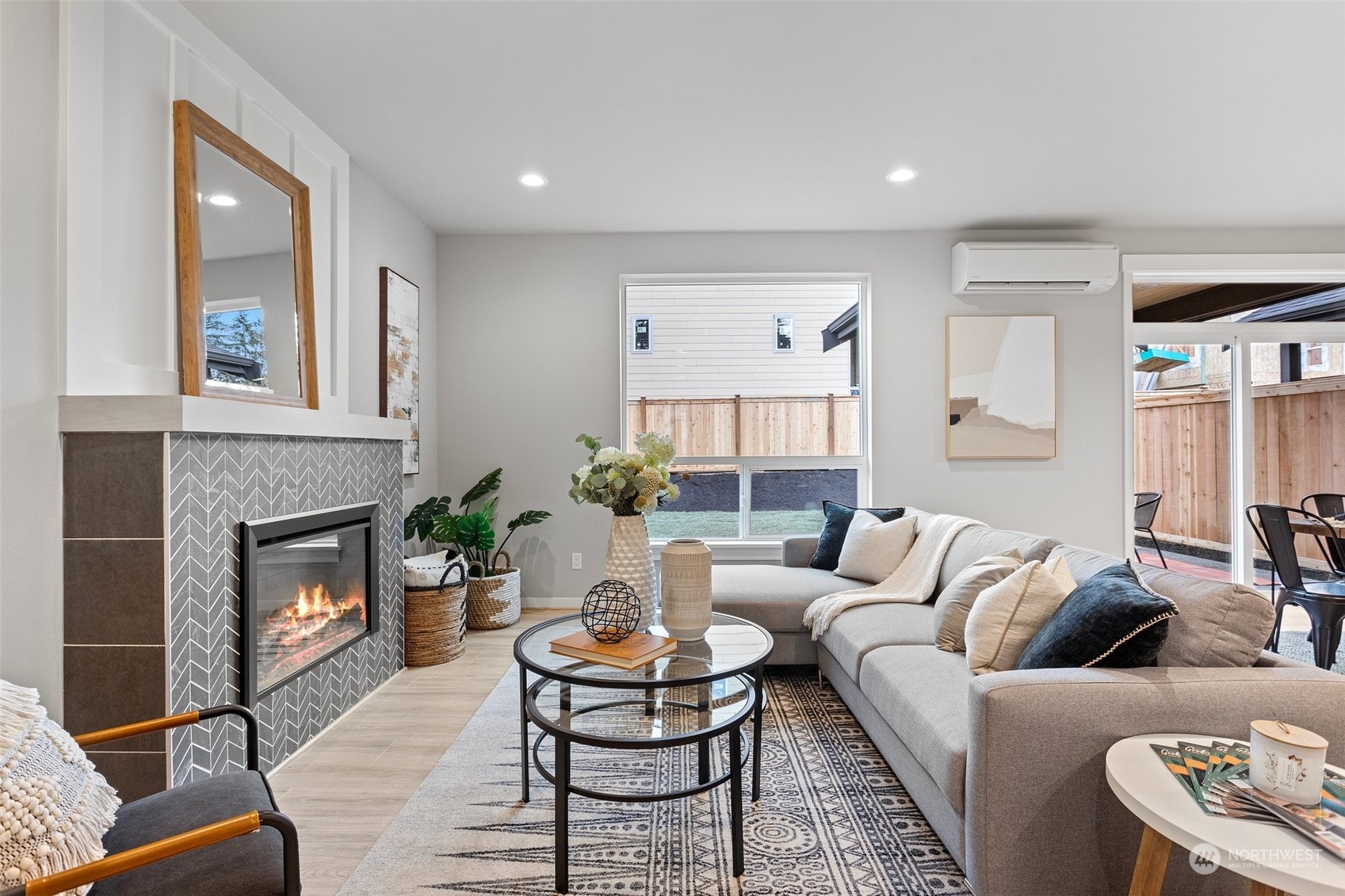 116 161st Street Southeast, Unit 1 Bothell, WA 98012 - Photo 4 of 37 a living room with furniture and a fireplace