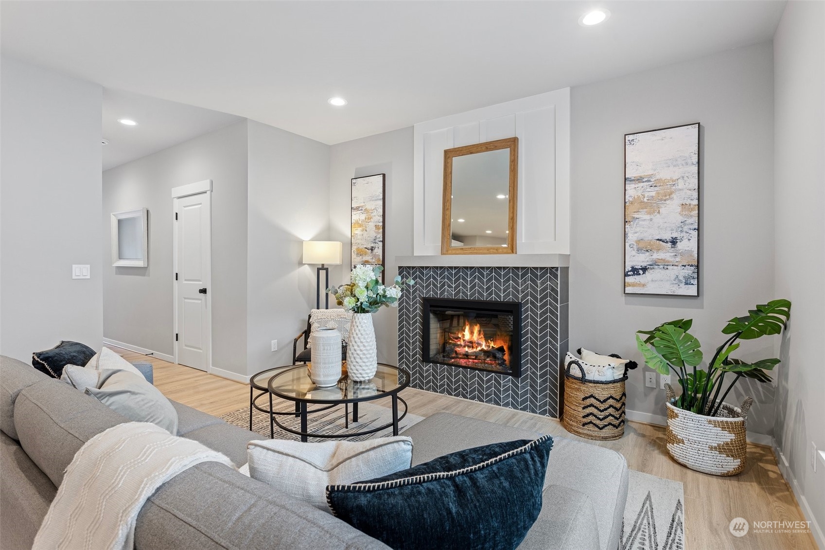 116 161st Street Southeast, Unit 1 Bothell, WA 98012 - Photo 6 of 37 a living room with furniture and a fireplace